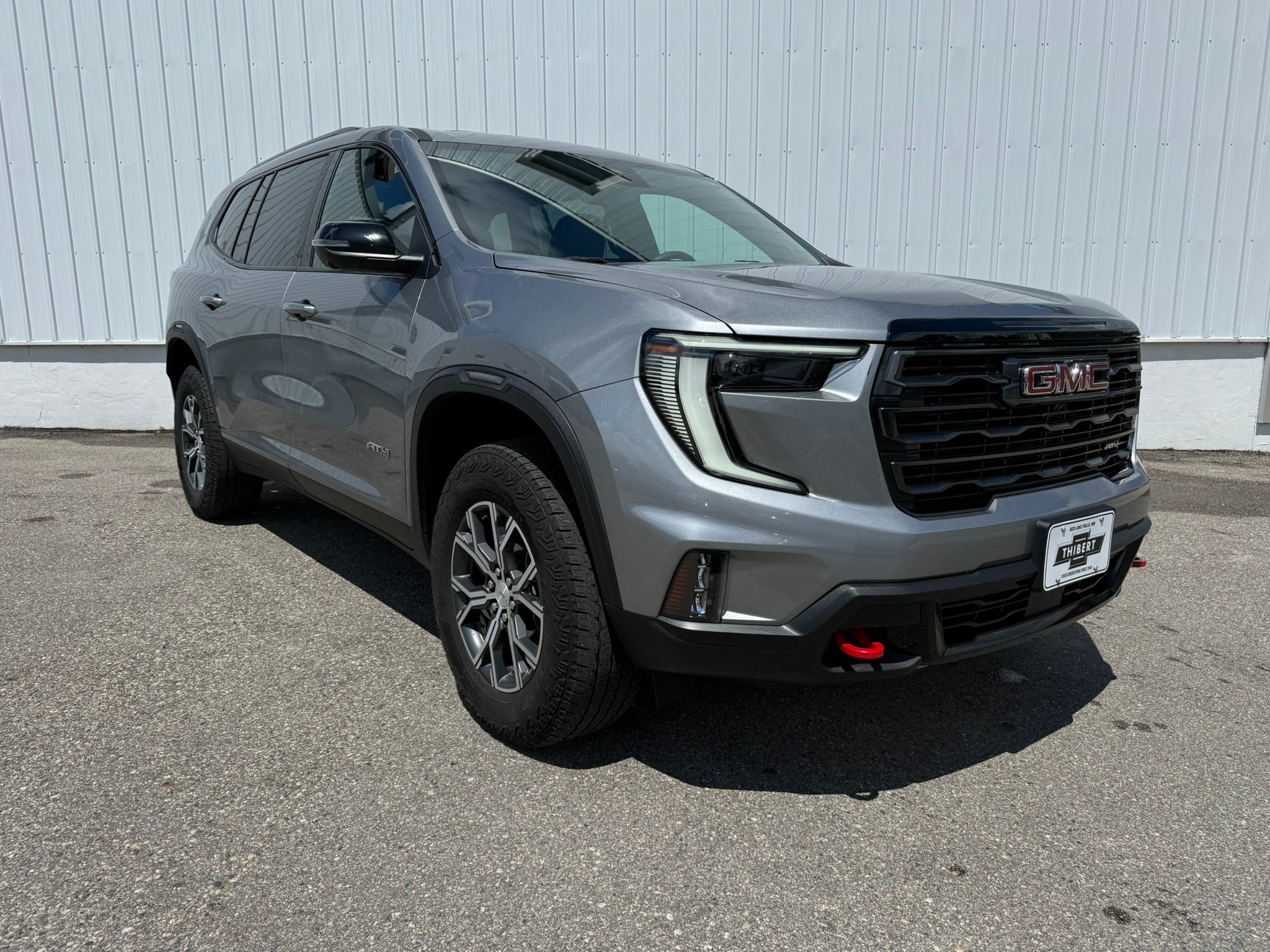 2024 GMC Acadia AT4 in Sterling Metallic — front three-quarter view