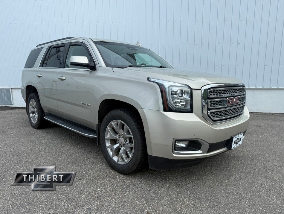 2015 GMC Yukon SLT in Champagne Silver Metallic — front three-quarter view