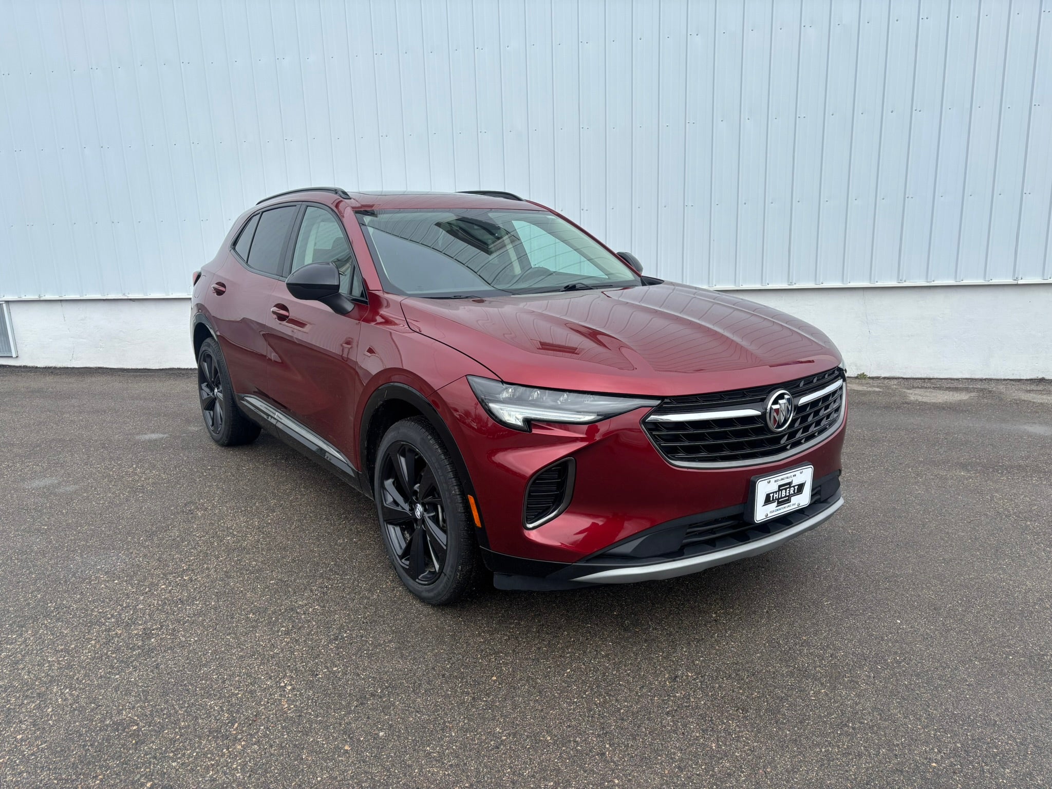 2022 Buick Envision Essence in Cinnabar Metallic — front three-quarter view